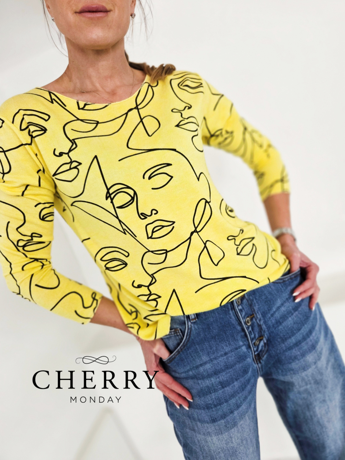 Tanjši volnen pulover s potiskom obrazov