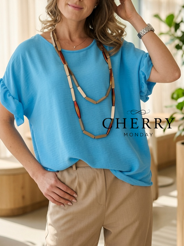 grok_image_1782150087003 Bluza z volančkom na rokavu