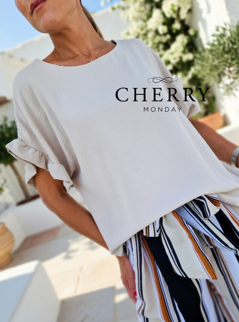 grok_image_1782150111796 Bluza z volančkom na rokavu