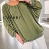 grok-image-0222c4a5-a2cc-48a8-9bee-8163004a4ce1 Plus size bluza iz tančice