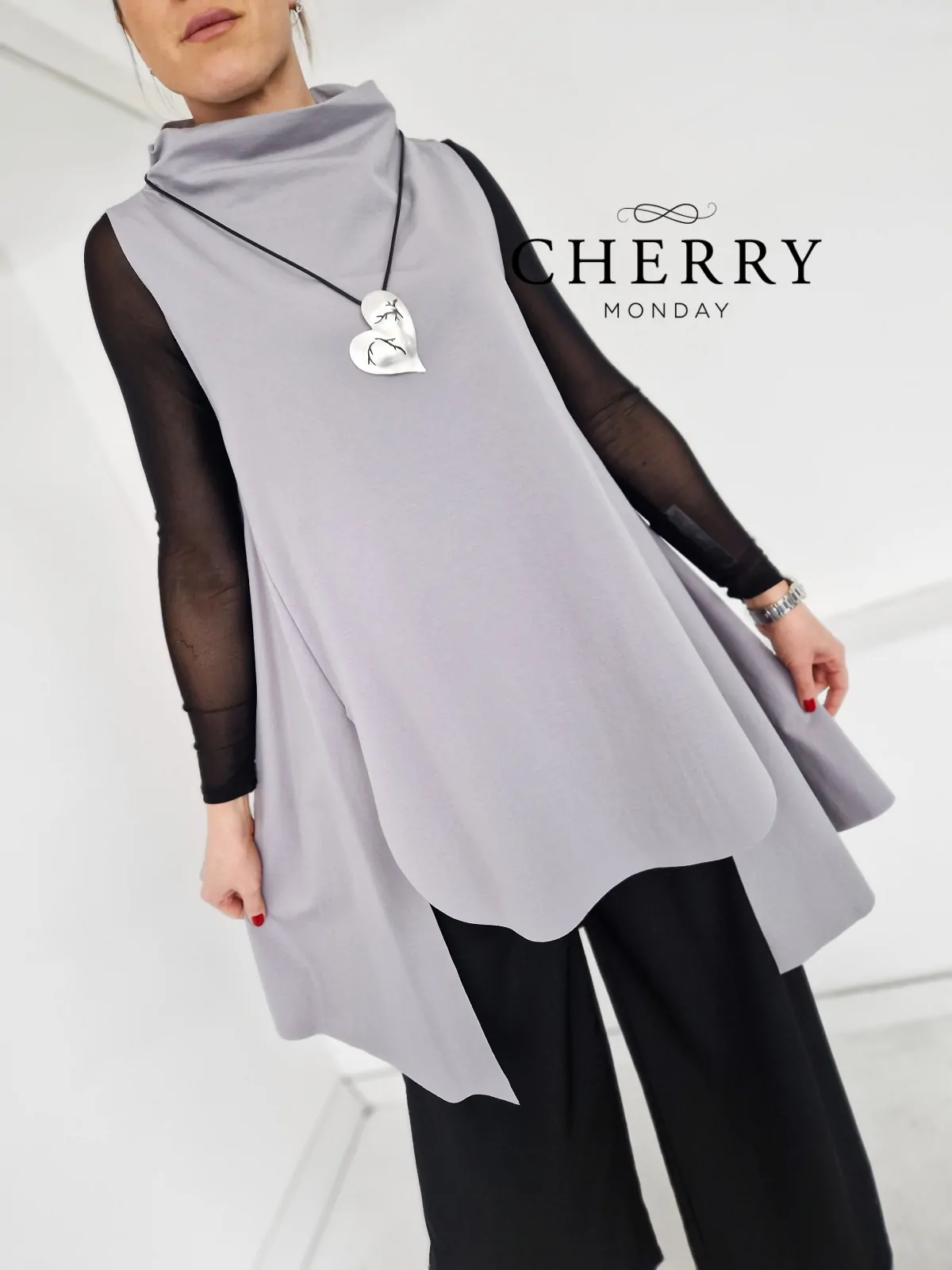 Daljši asimetrični brezrokavnik